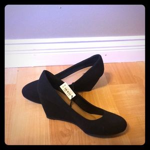 Size 8, suede, black wedges.